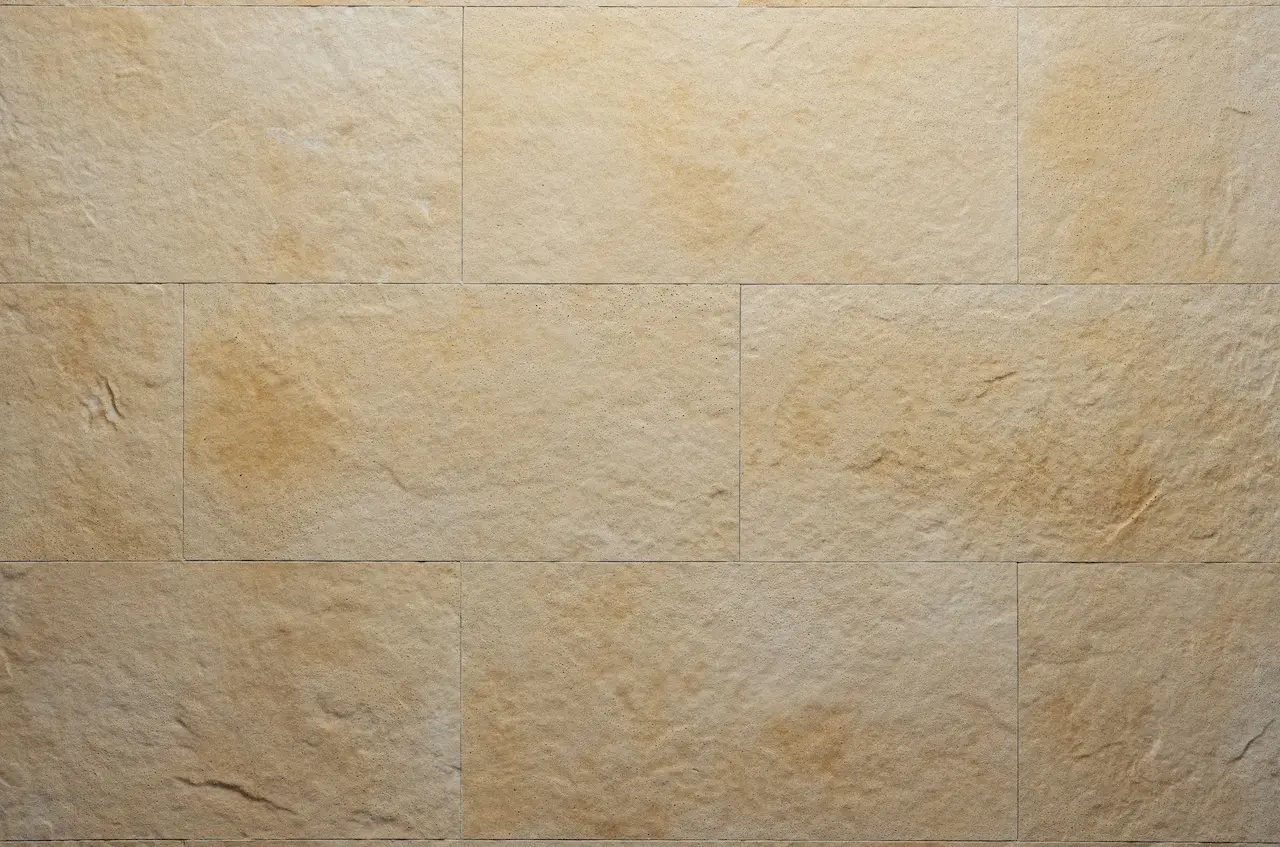 Sandy-beige R03 El Arabia flexible tile with a travertine texture and warm reddish mottling