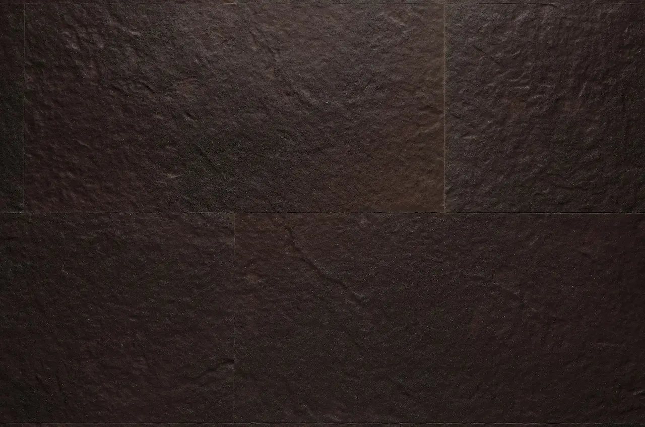 Dark brown R07 Chocolate Rock flexible tile with a stone relief and fine black flecks