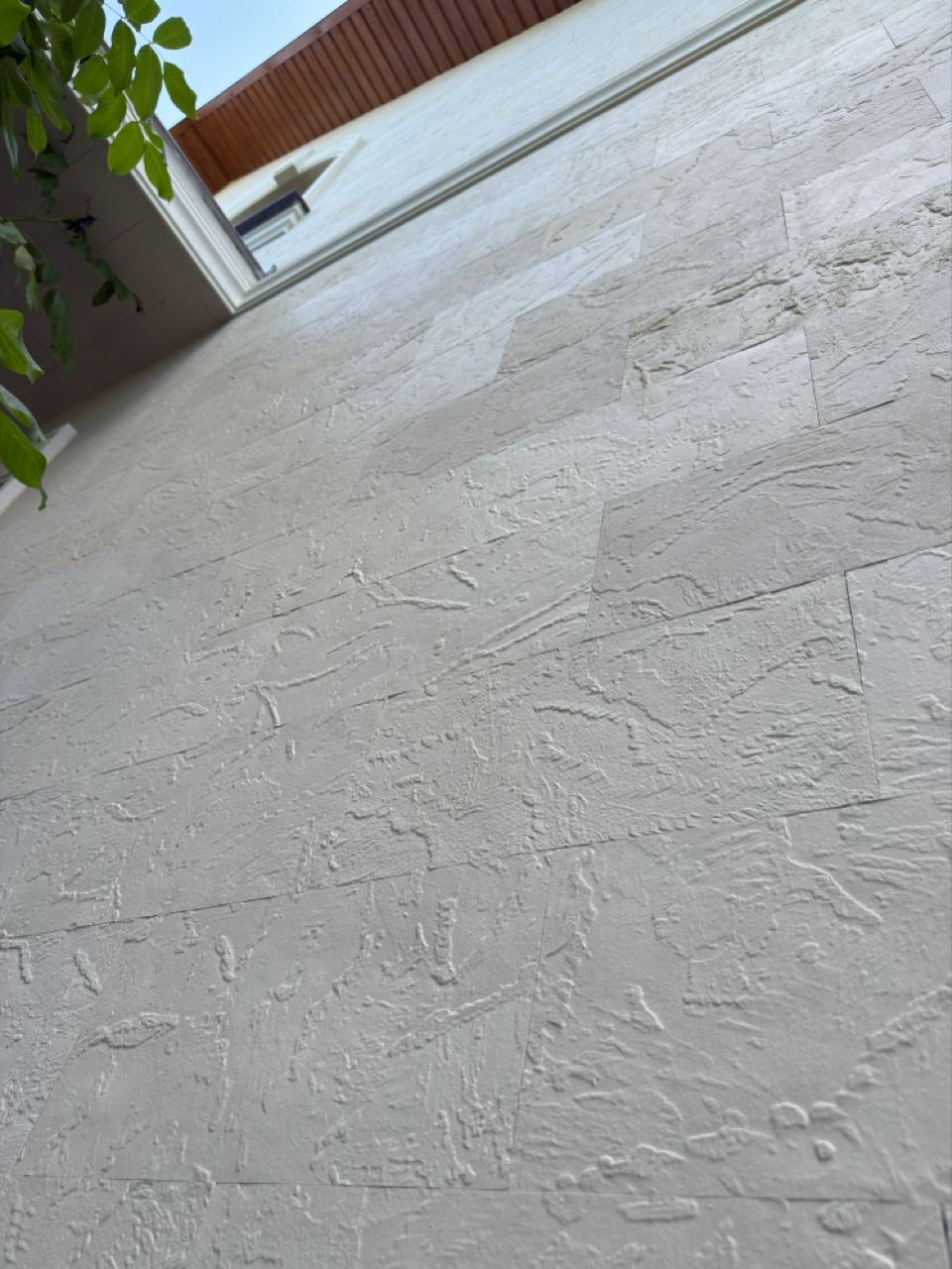 Close-up of the fine texture of the light flexible stone on the walls
